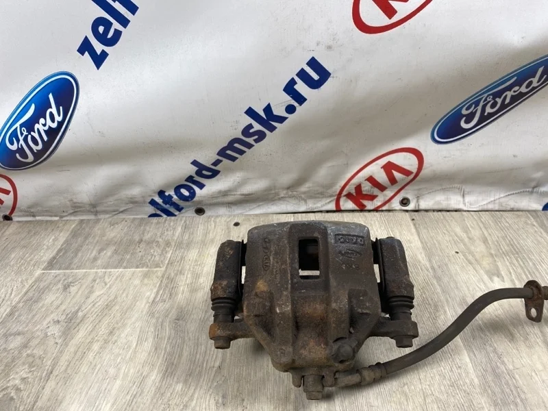 Суппорт тормозной KIA RIO 2010