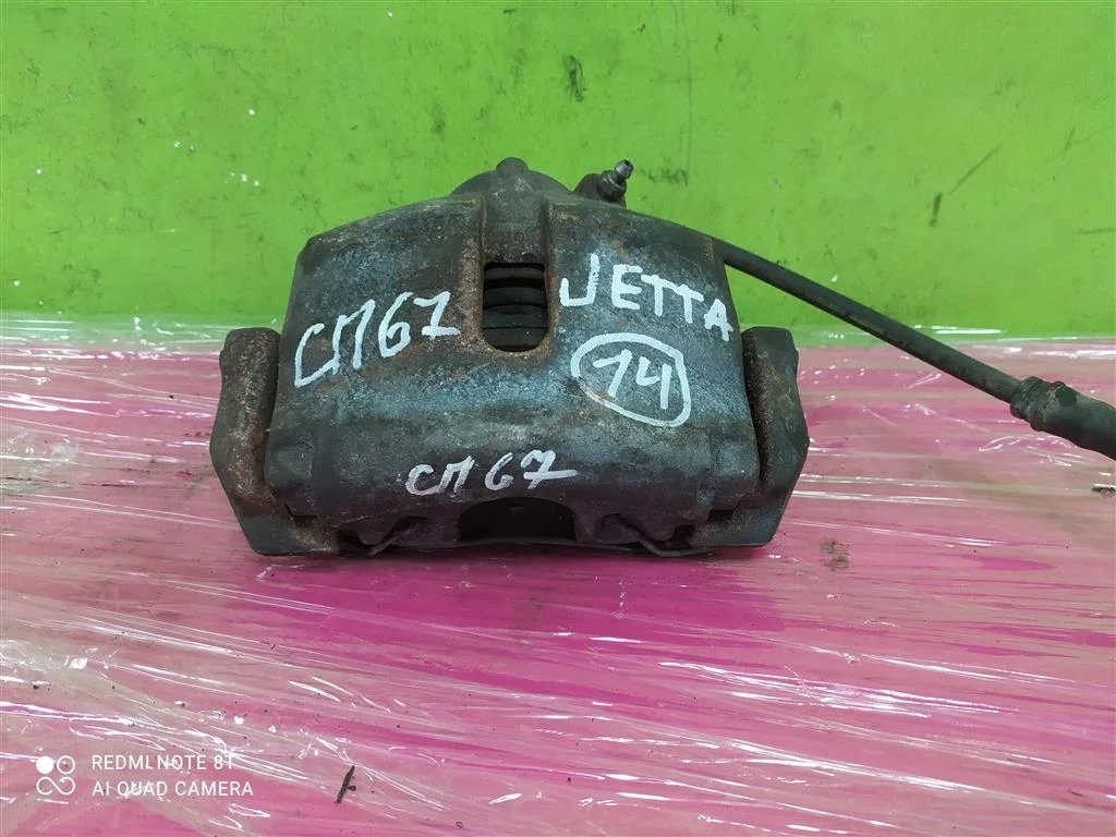 Суппорт передний левый Джетта Гольф Пассат СС Б6