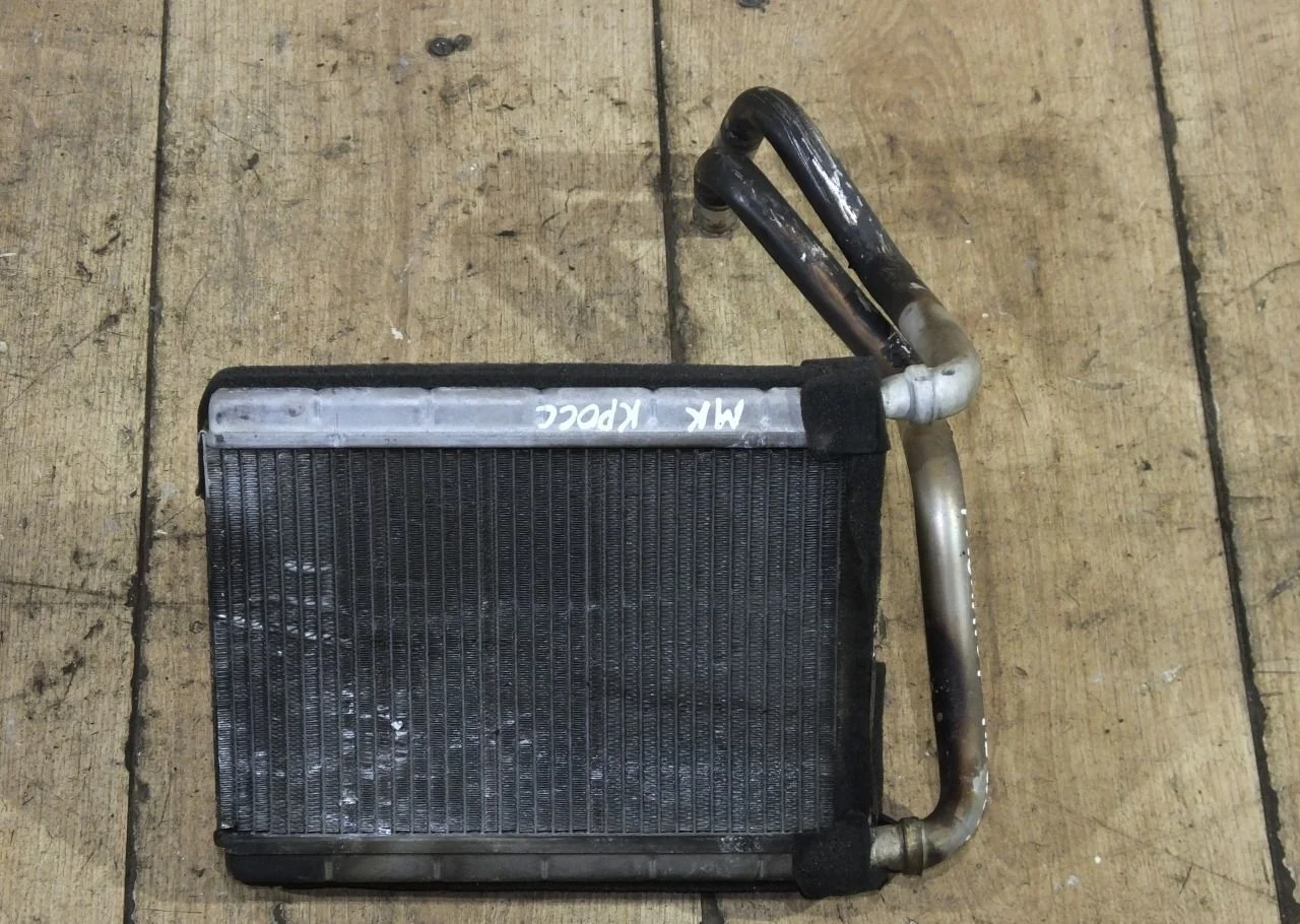 Радиатор отопителя Geely MK Cross