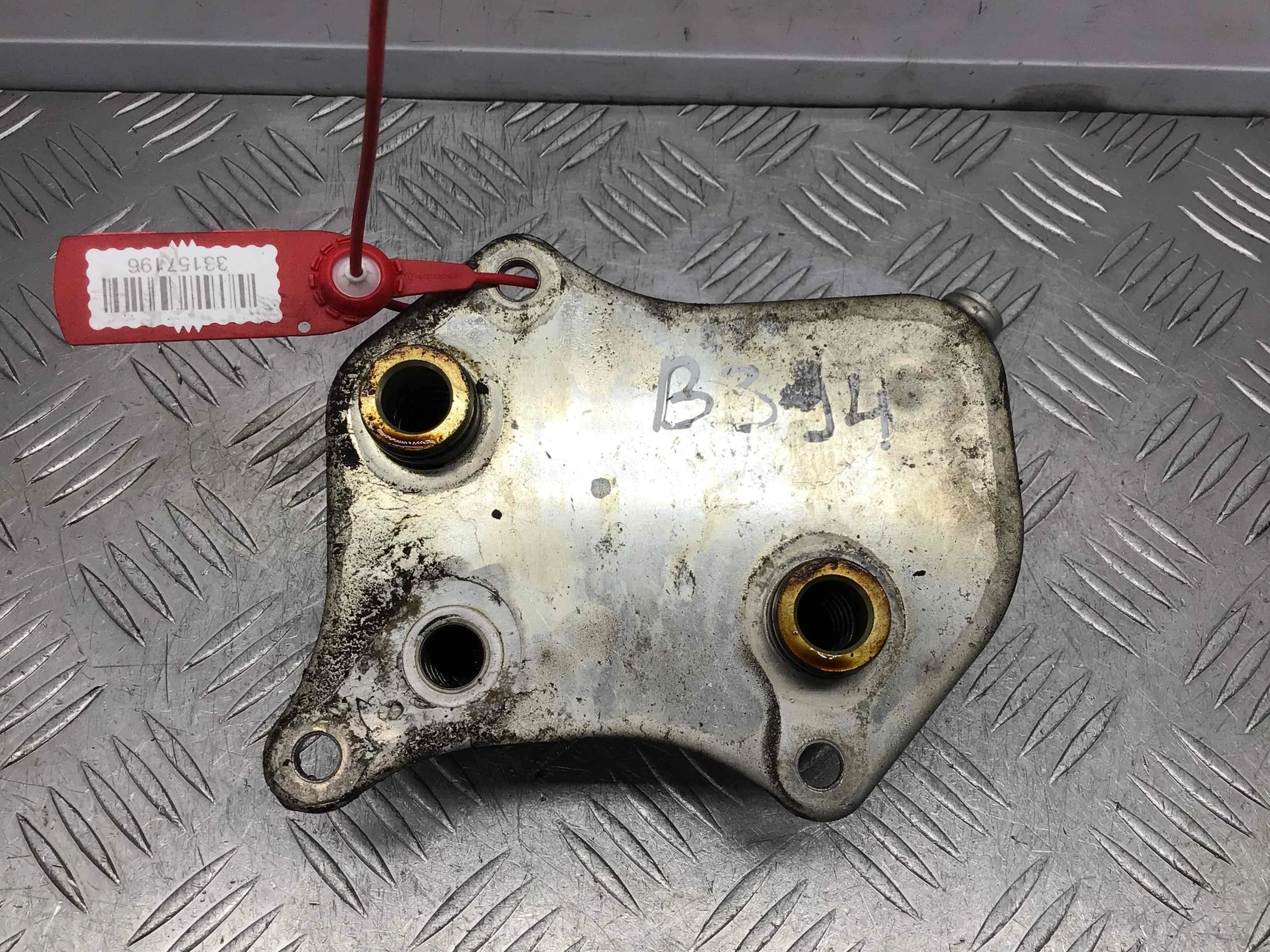 Теплообменник масляного фильтра Volkswagen Passat B5+ [рестайлинг] (2000-2005) бензин 2.0 i Механика Седан