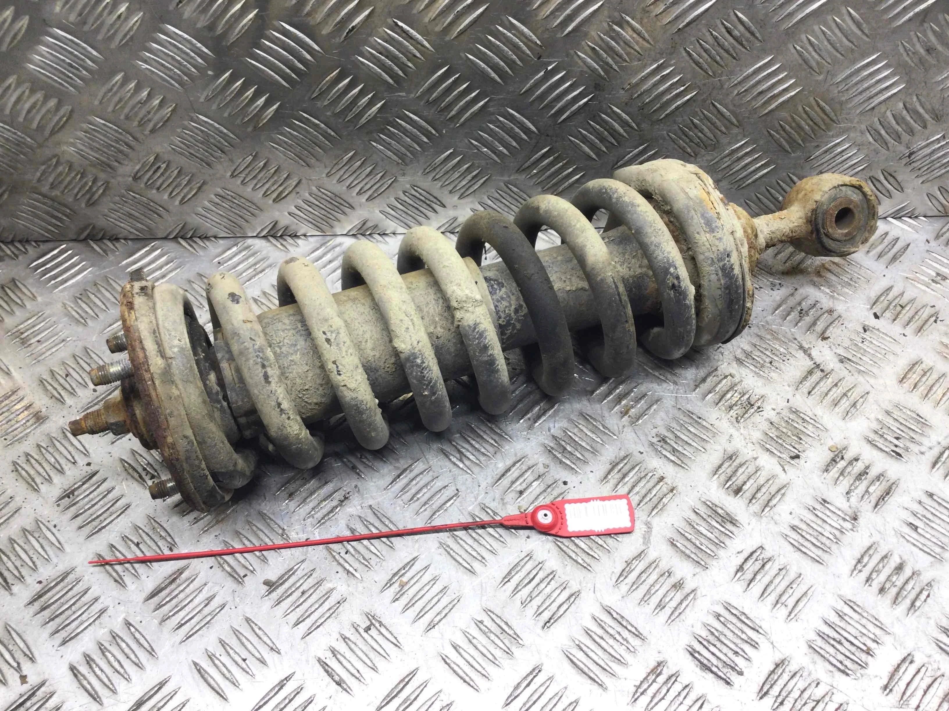 Стойка передняя левая Nissan Navara D40 (2005-2010) дизель 2.5  Механика