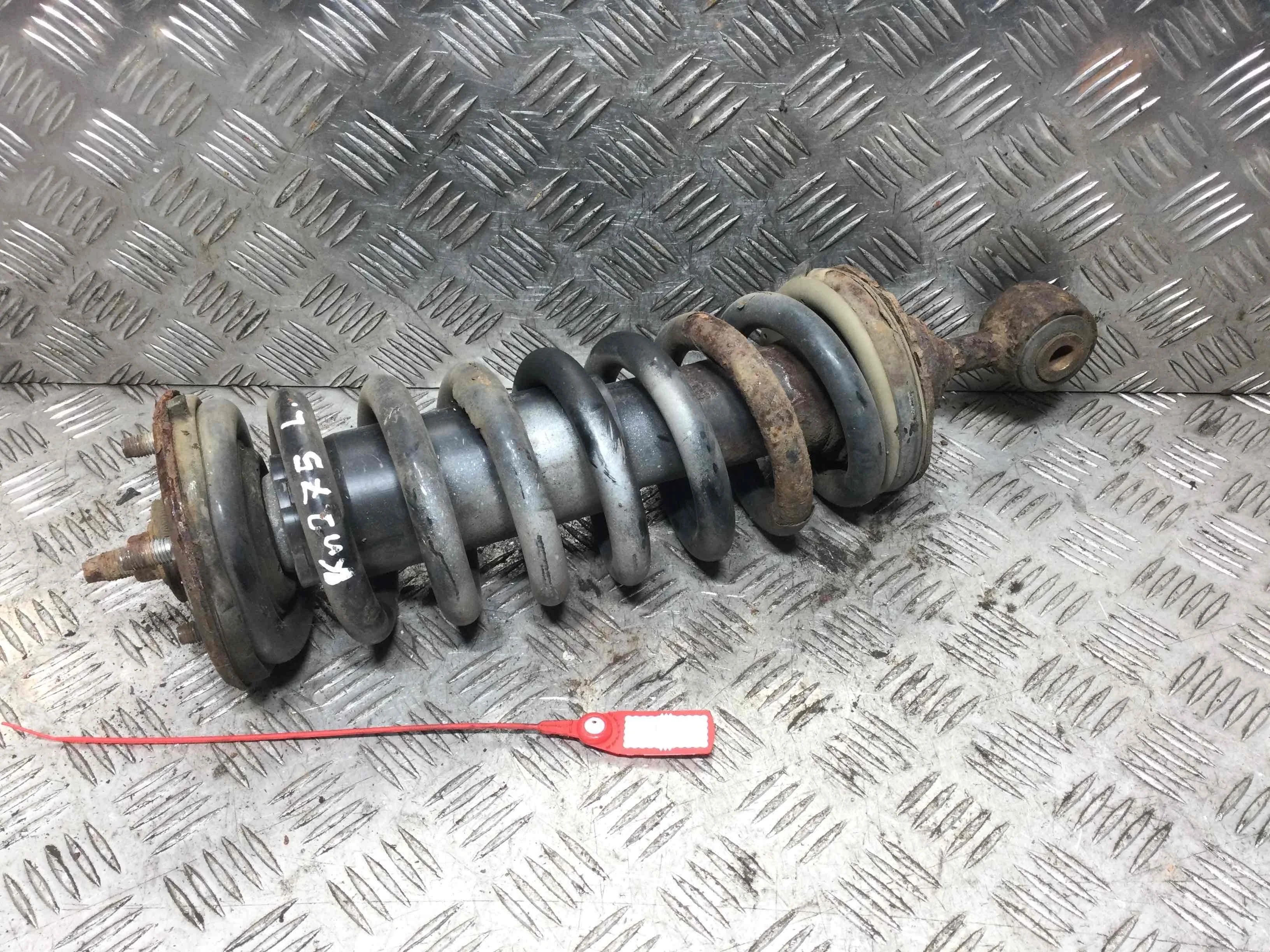 Стойка передняя левая Nissan Navara D40 (2005-2010) дизель 2.5  Механика