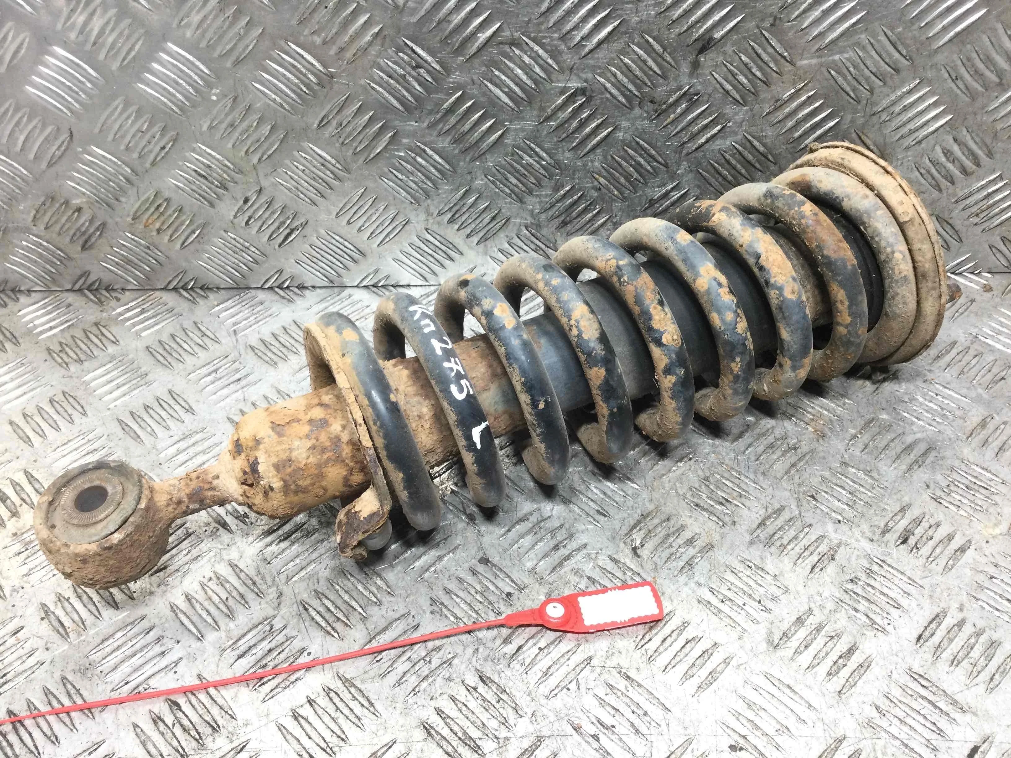 Стойка передняя левая Nissan Navara D40 (2005-2010) дизель 2.5  Механика