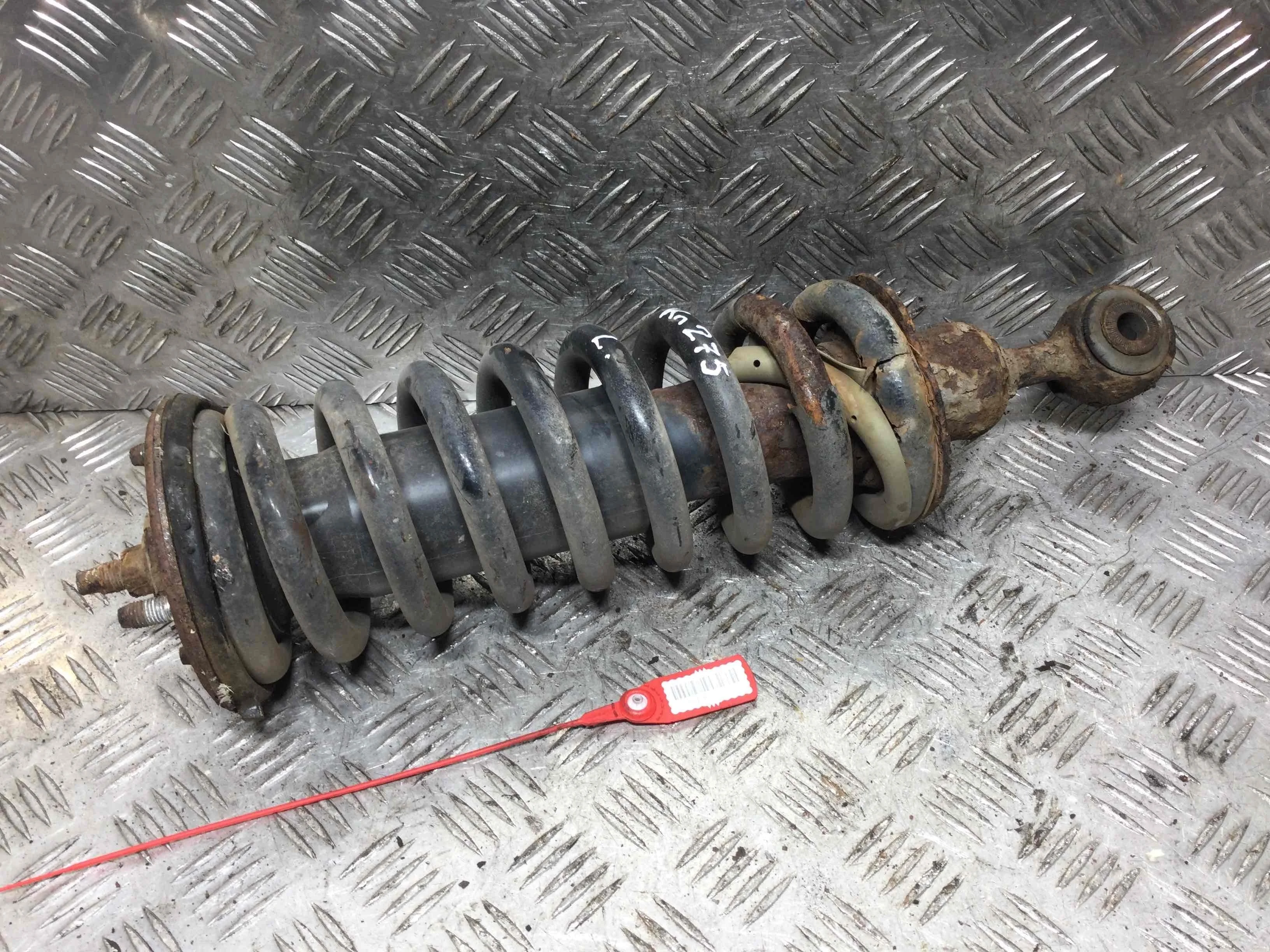 Стойка передняя левая Nissan Navara D40 (2005-2010) дизель 2.5  Механика