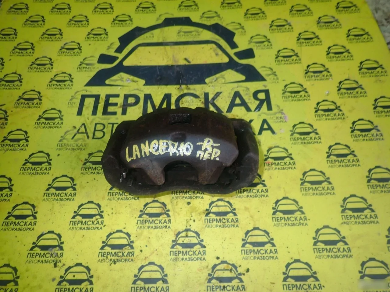 Суппорт передний правый Mitsubishi Lancer 10