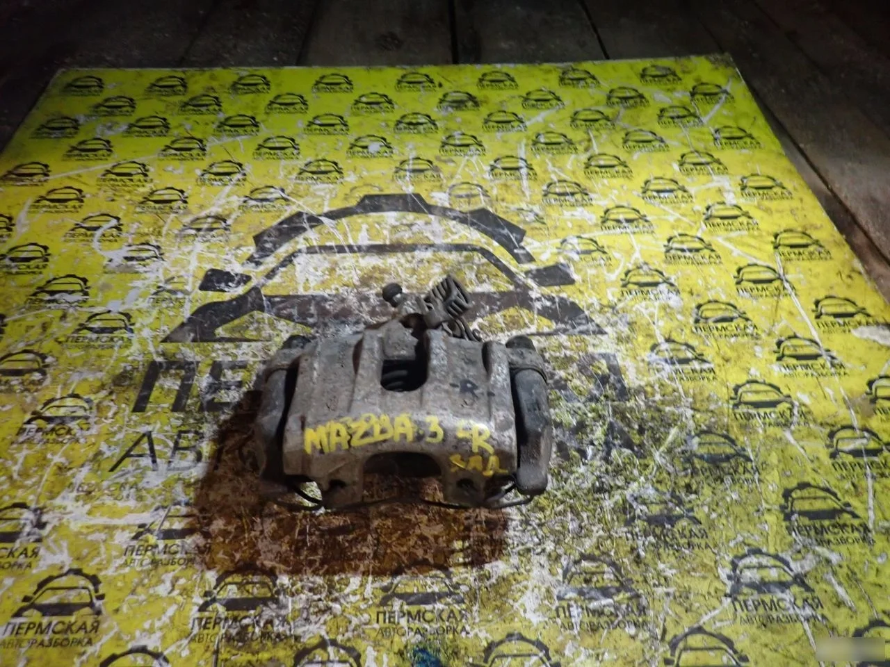 Суппорт тормозной задний правый Mazda 3 BL