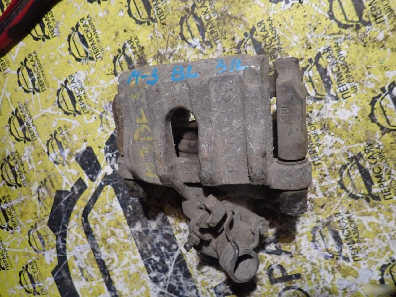 Суппорт тормозной задний левый Mazda 3 BL