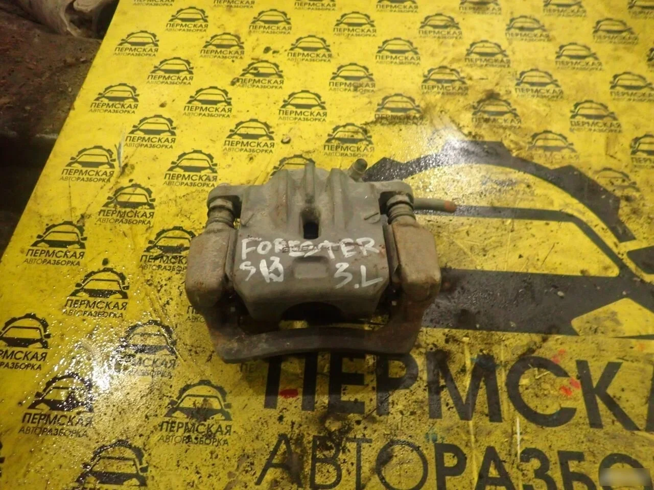 Суппорт тормозной задний левый Subaru Forester s13