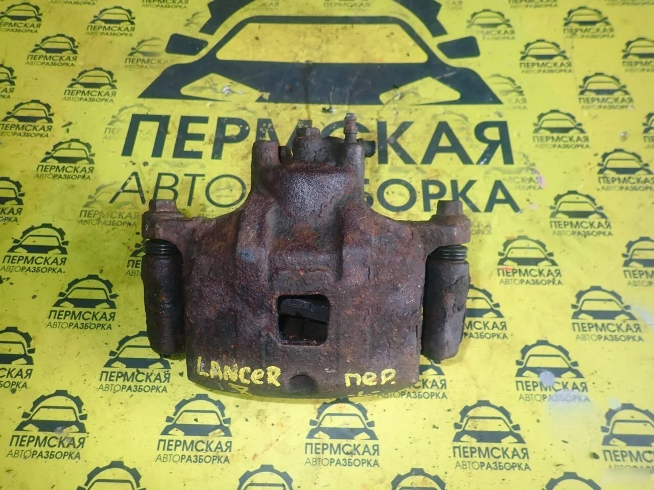 Суппорт передний левый Mitsubishi Lancer X