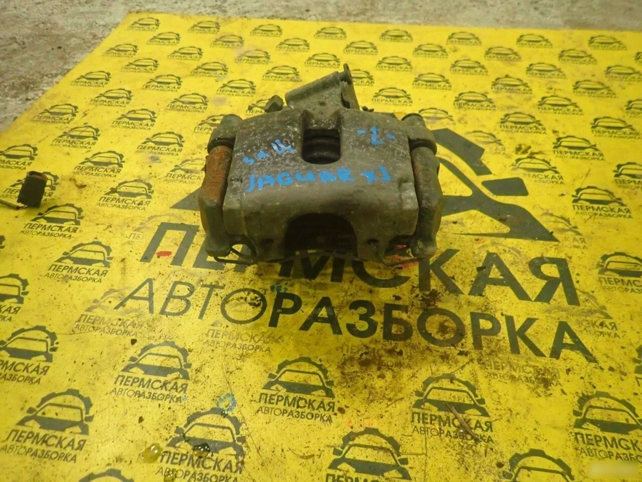 Суппорт тормозной задний левый для Jaguar XJ 2009)