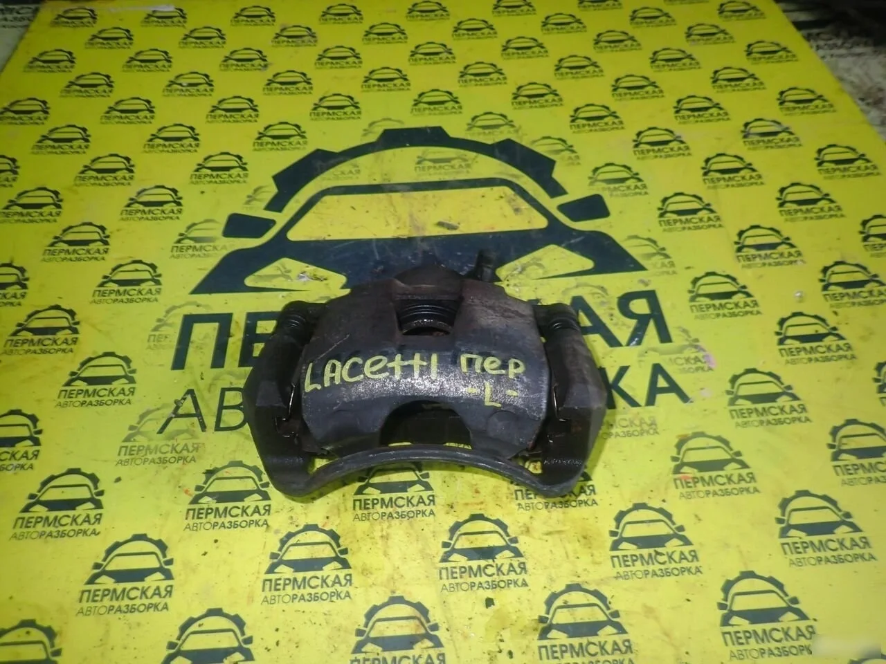 Суппорт передний левый Chevrolet Lacetti