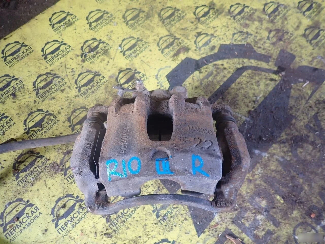 Суппорт тормозной передний правый для Kia RIO 3