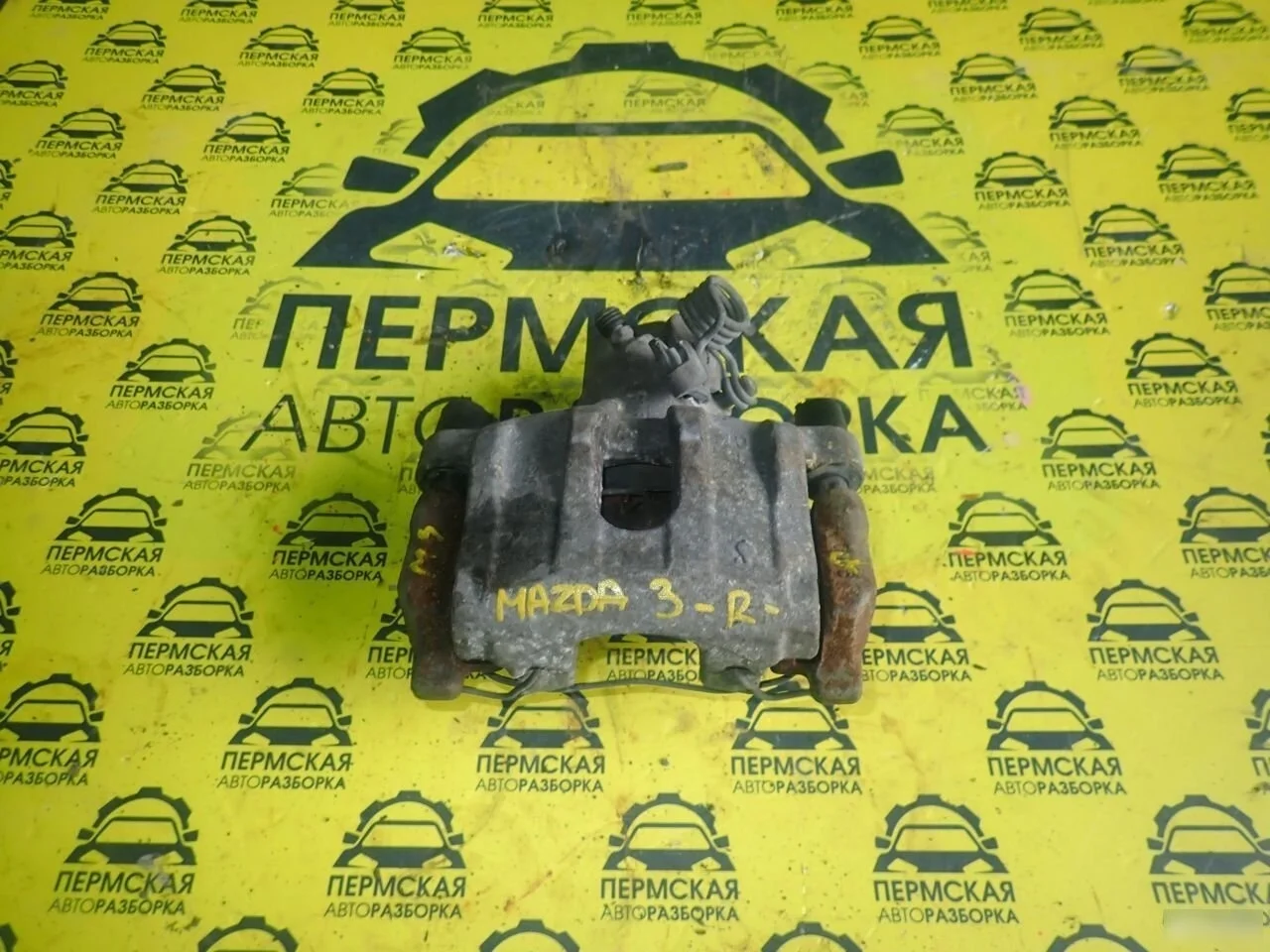 Суппорт тормозной задний правый Mazda 3 BK