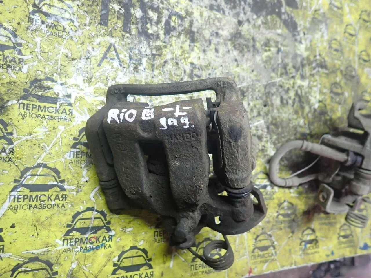 Суппорт тормозной задний левый Kia RIO 2011-2017