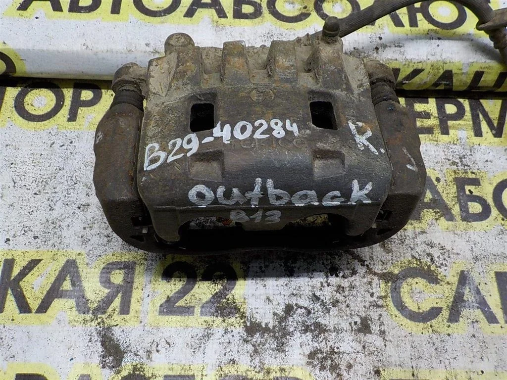 Суппорт передний правый Subaru Outback