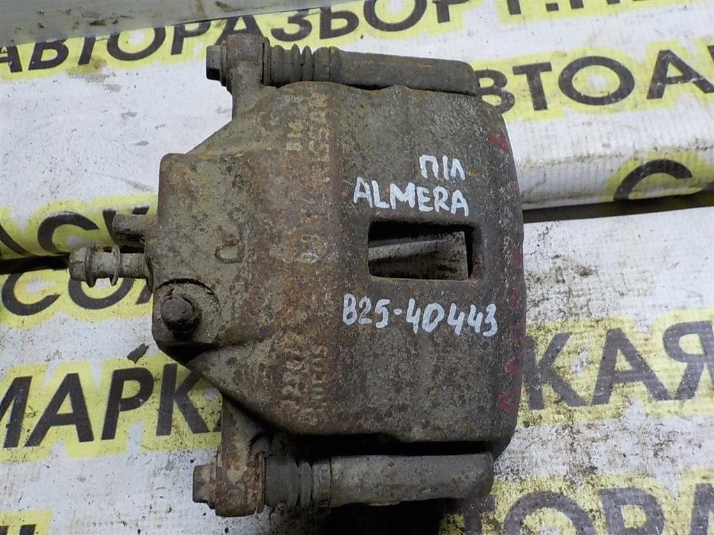 Суппорт передний левый Nissan Almera N16 (2000—2003)