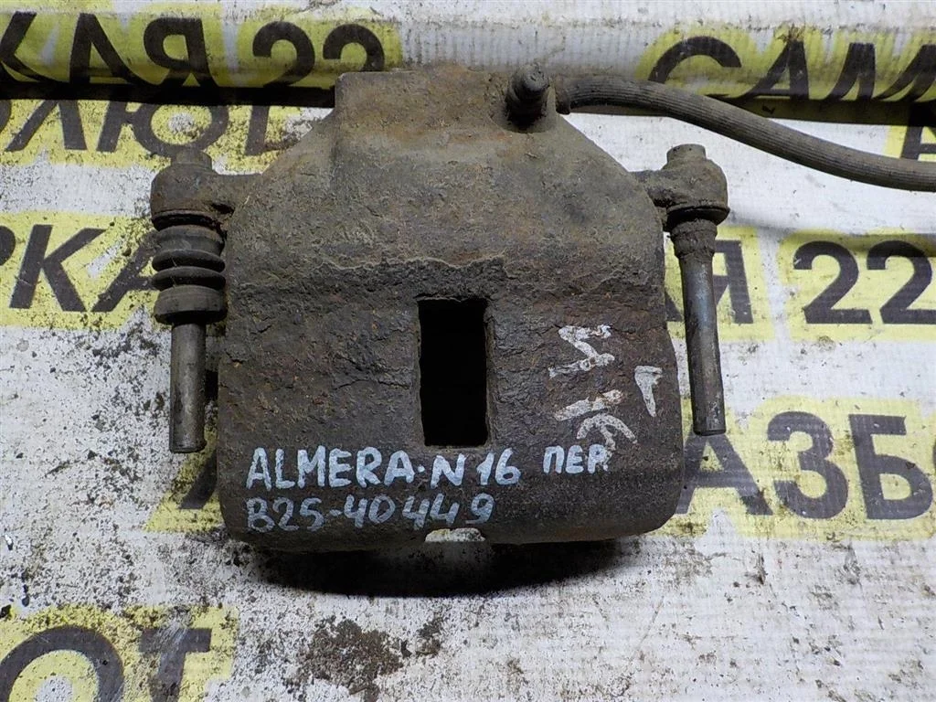 Суппорт передний правый Nissan Almera N16 (2000—2003)