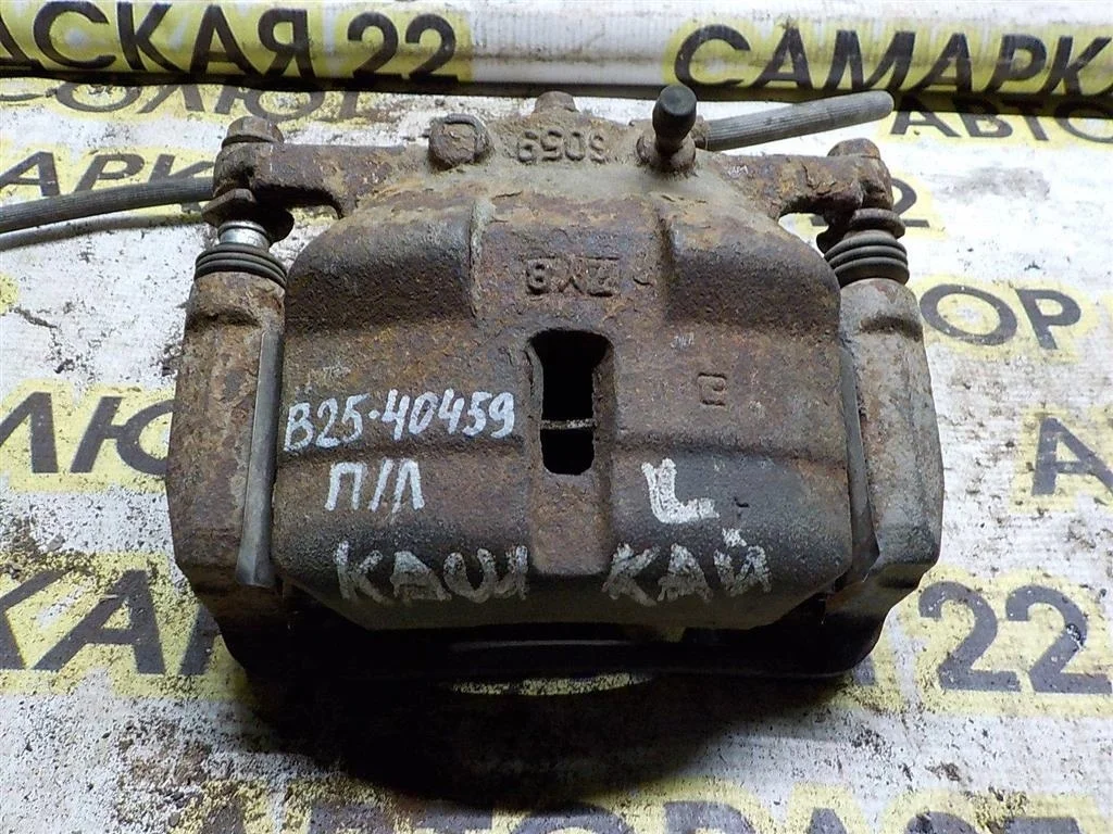 Суппорт передний левый Nissan Qashqai I (2006—2010)