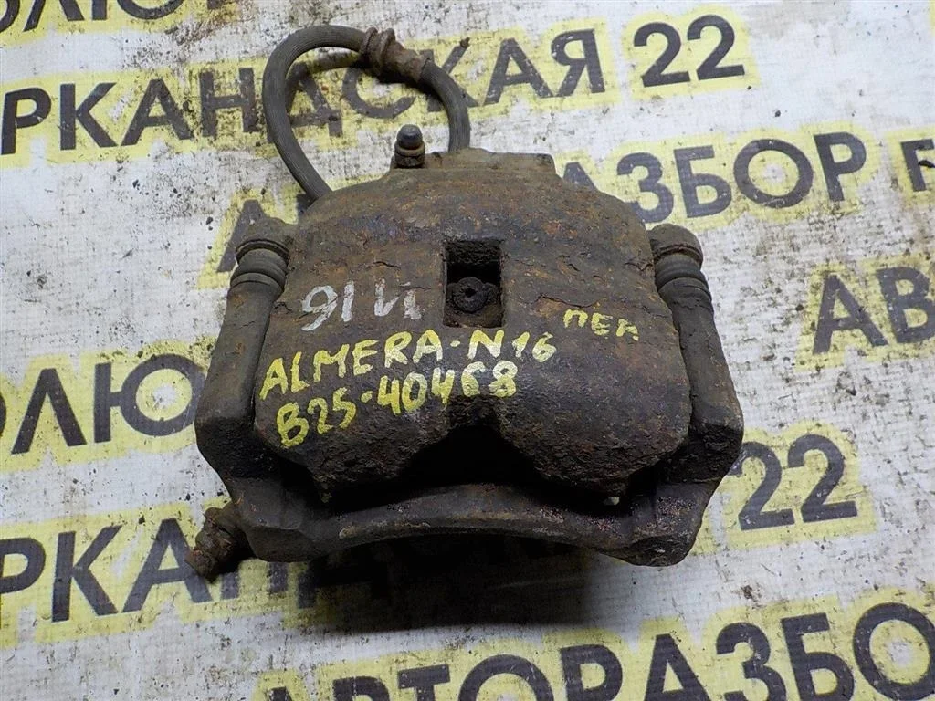 Суппорт передний правый Nissan Almera N16 (2000—2003)