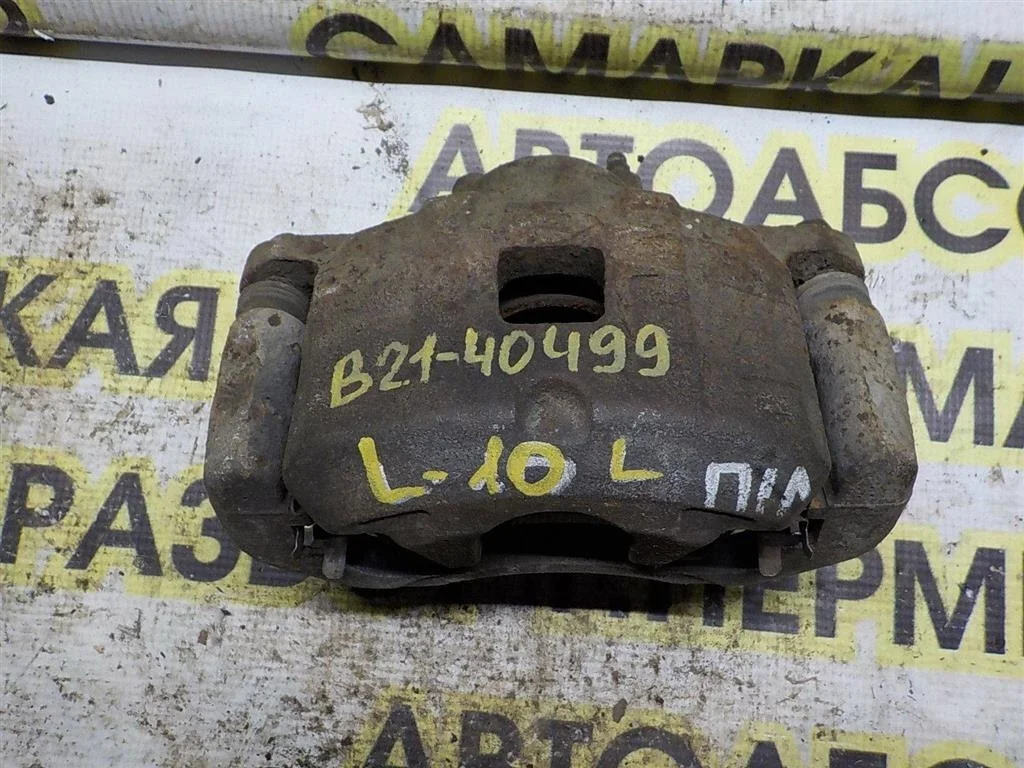 Суппорт передний левый Mitsubishi Lancer X (2007—2010)