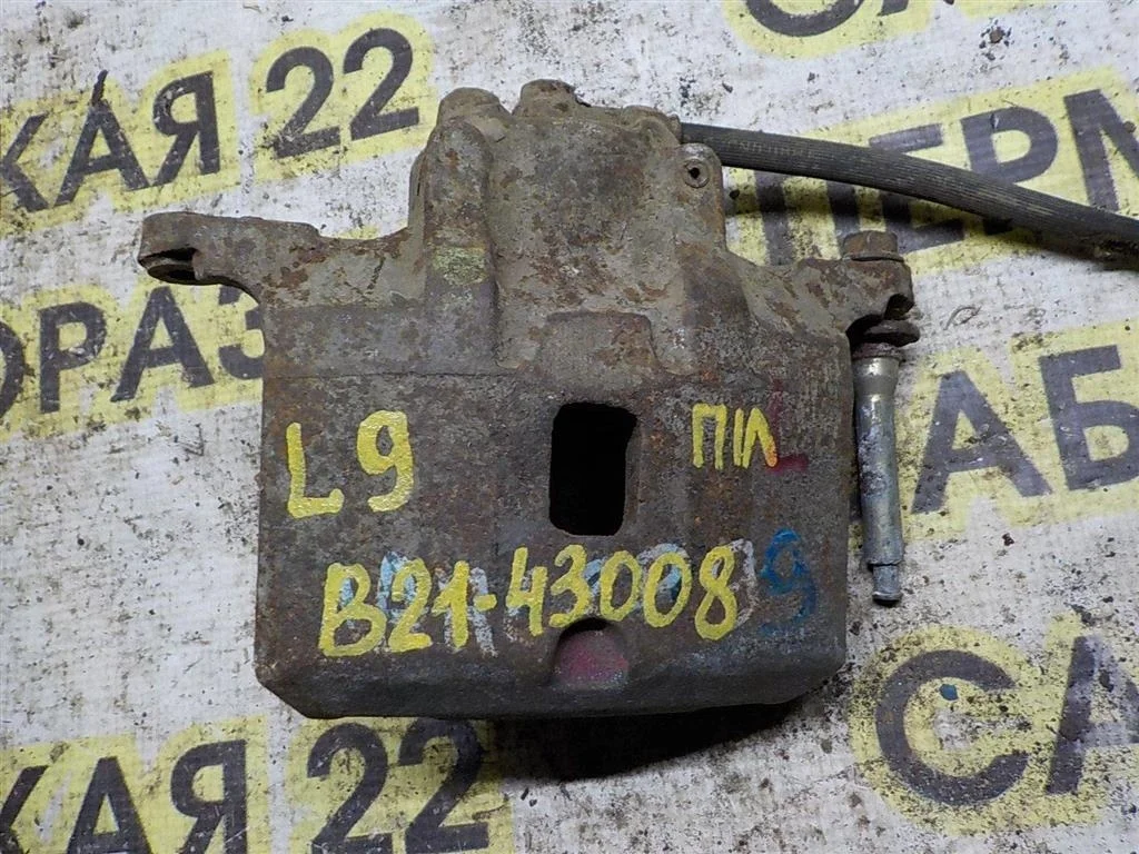 Суппорт передний левый Mitsubishi Lancer IX (2000—2007)