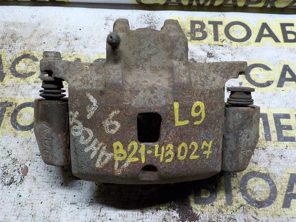 Суппорт передний левый Mitsubishi Lancer IX (2000—2007)