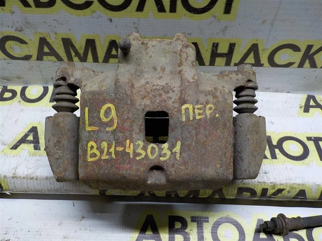 Суппорт передний левый Mitsubishi Lancer IX (2000—2007)