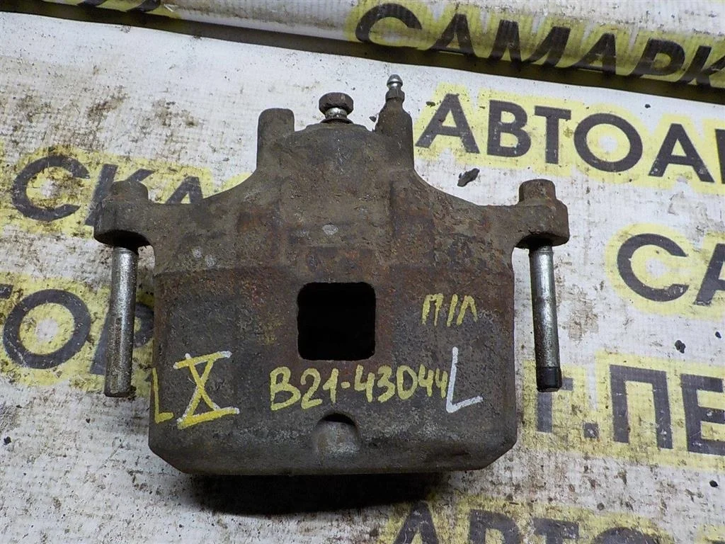 Суппорт передний левый Mitsubishi Lancer X (2007—2010)