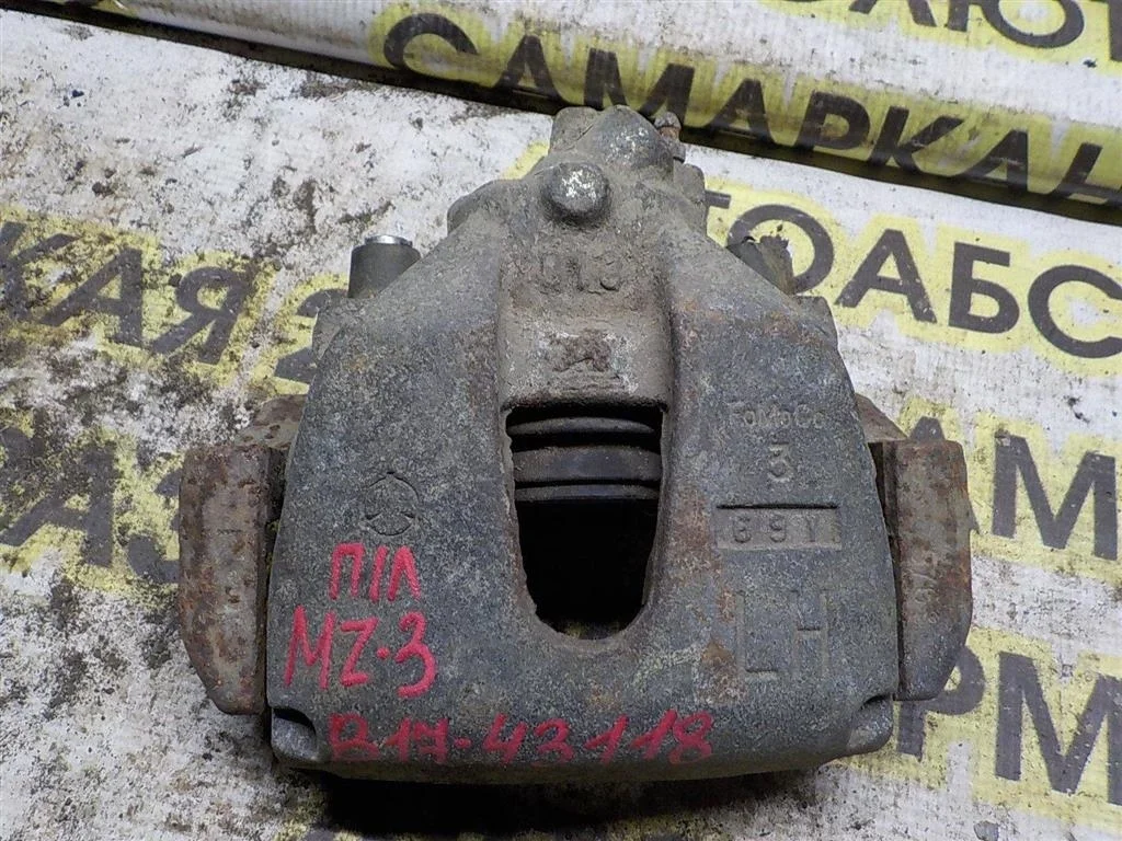 Суппорт передний левый Mazda 3 BK (2003—2006)