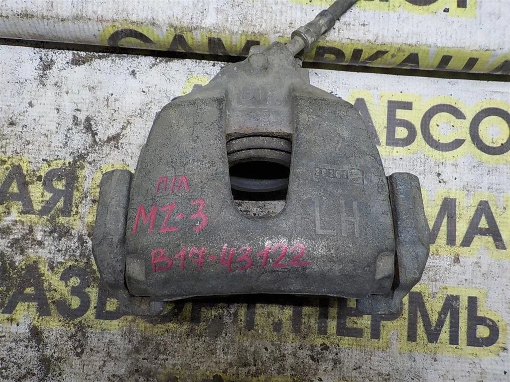 Суппорт передний левый Mazda 3 BL (2008—2011)