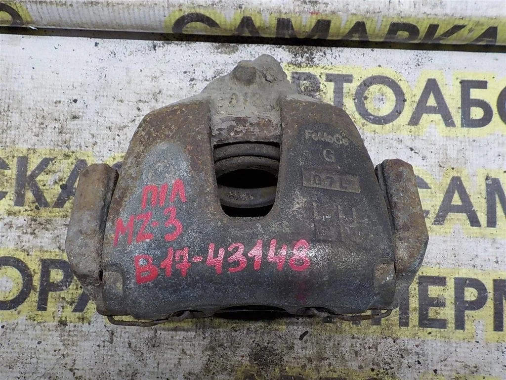 Суппорт передний левый Mazda 3 BK (2003—2006)