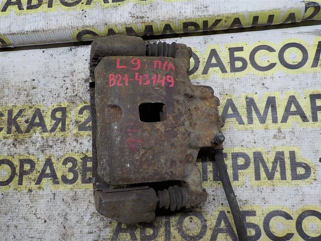 Суппорт передний левый Mitsubishi Lancer IX (2000—2007)