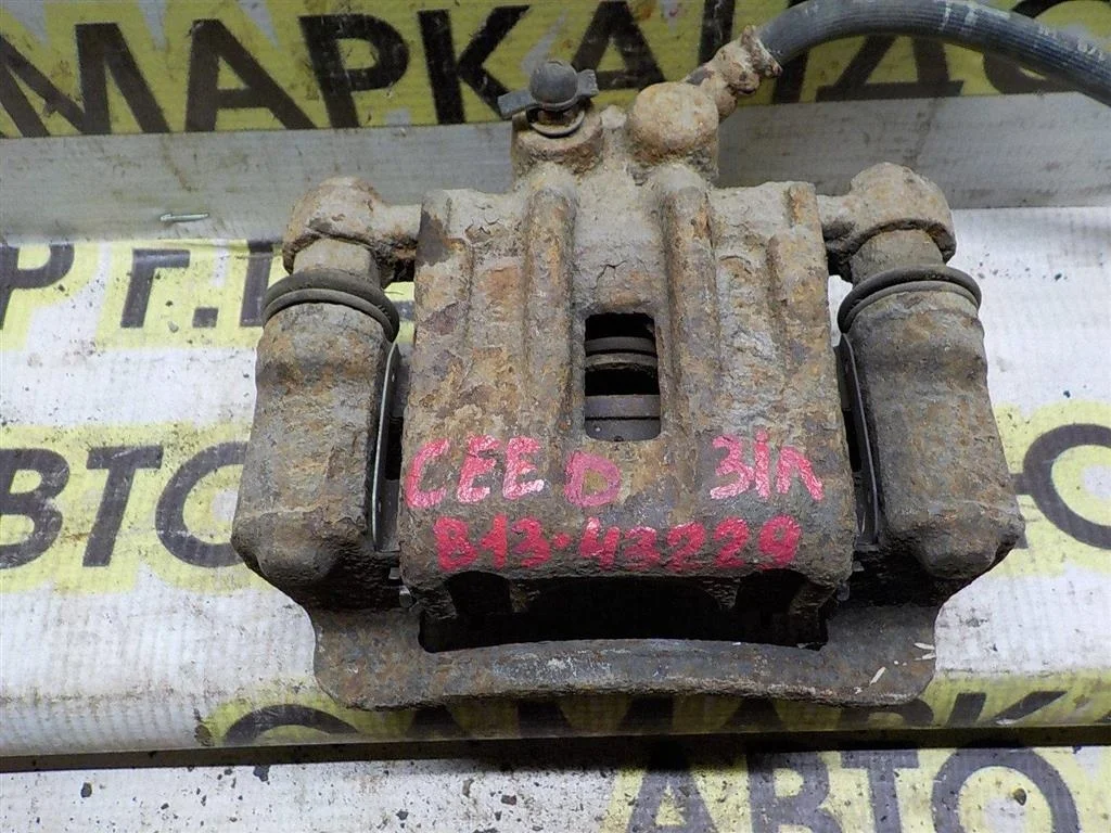 Суппорт задний левый KIA Ceed ED (2006—2010)