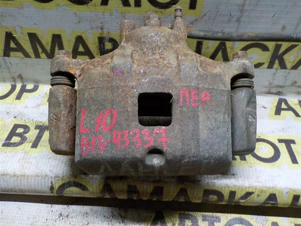 Суппорт передний левый Mitsubishi Lancer X (2007—2010)