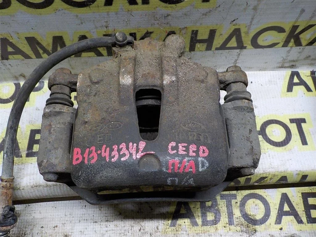 Суппорт передний левый KIA Ceed ED (2006—2010)