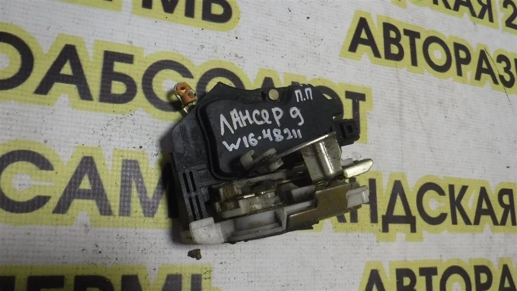 Замок двери передней правой Mitsubishi Lancer IX (2000—2007)