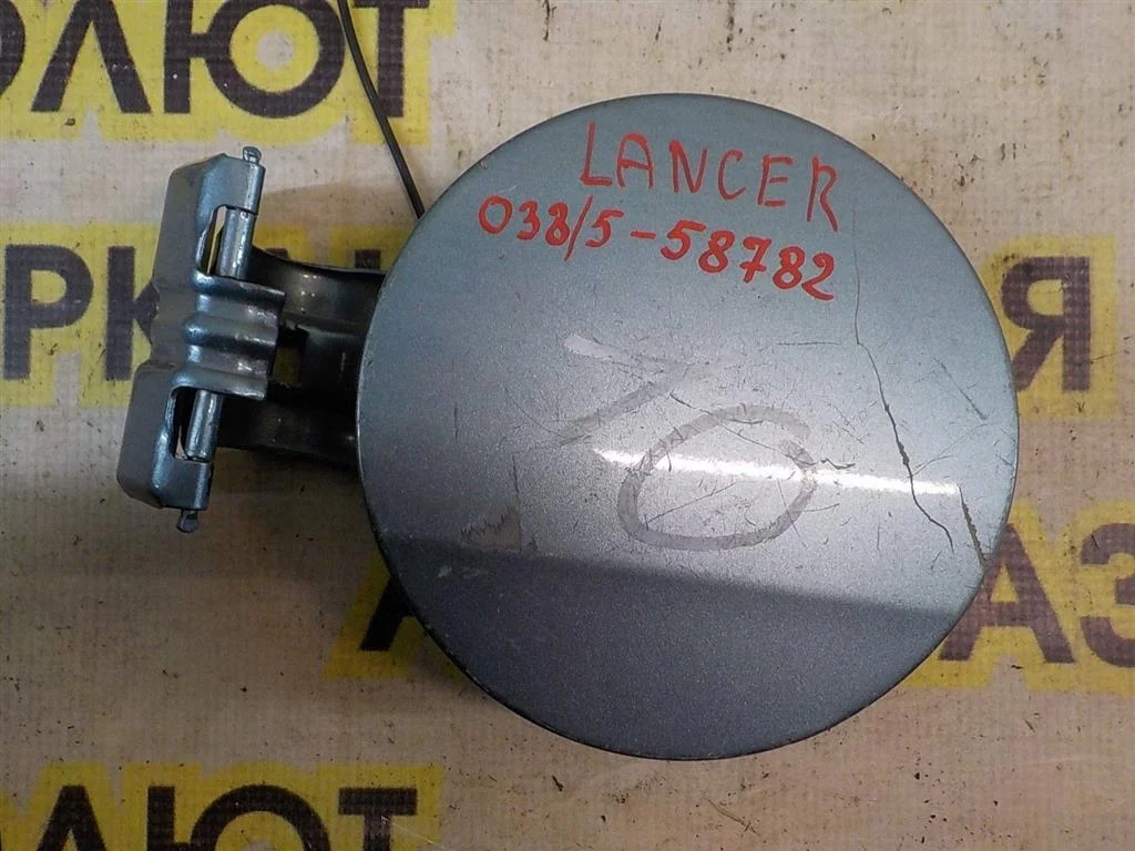 Лючок бензобака Mitsubishi Lancer X (2007—2010)