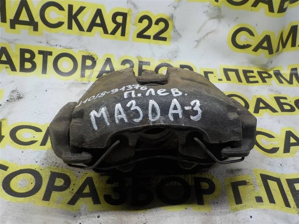 Суппорт передний левый Mazda 3 BL (2008—2011)