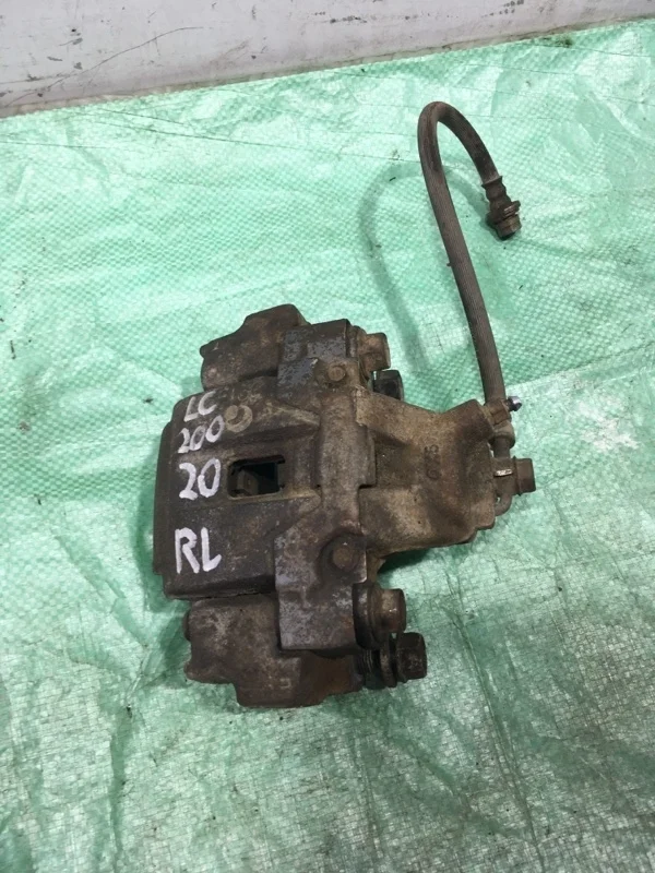 Суппорт тормозной Toyota Land Cruiser 200 2020 4785060110 URJ202 4.5 1VD-FTV, задний левый