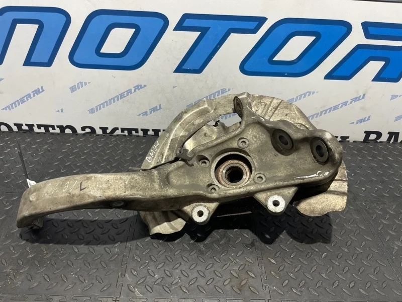 Кулак поворотный Bmw 31216869869 E70, передний левый