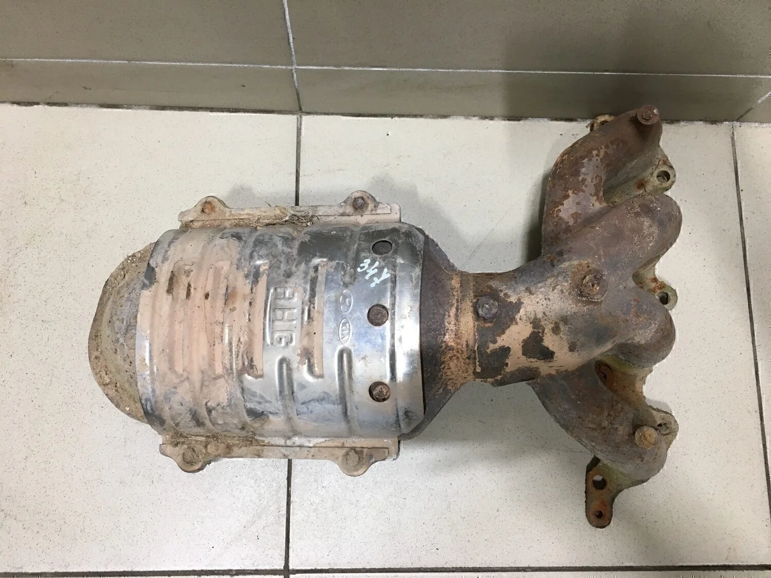 Коллектор выпускной RIO 2000-2004