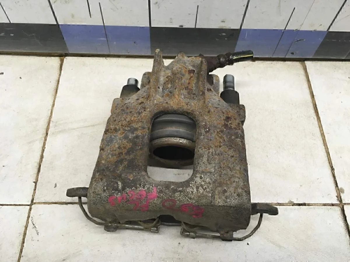 Суппорт передний левый Focus I 1998-2004