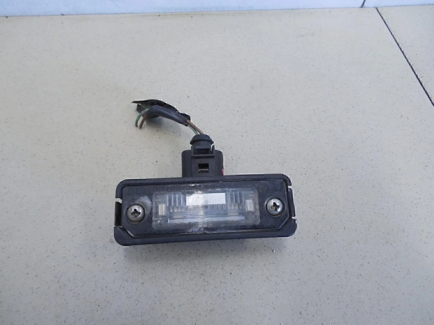 Фонарь подсветки номера Golf V 2003-2009