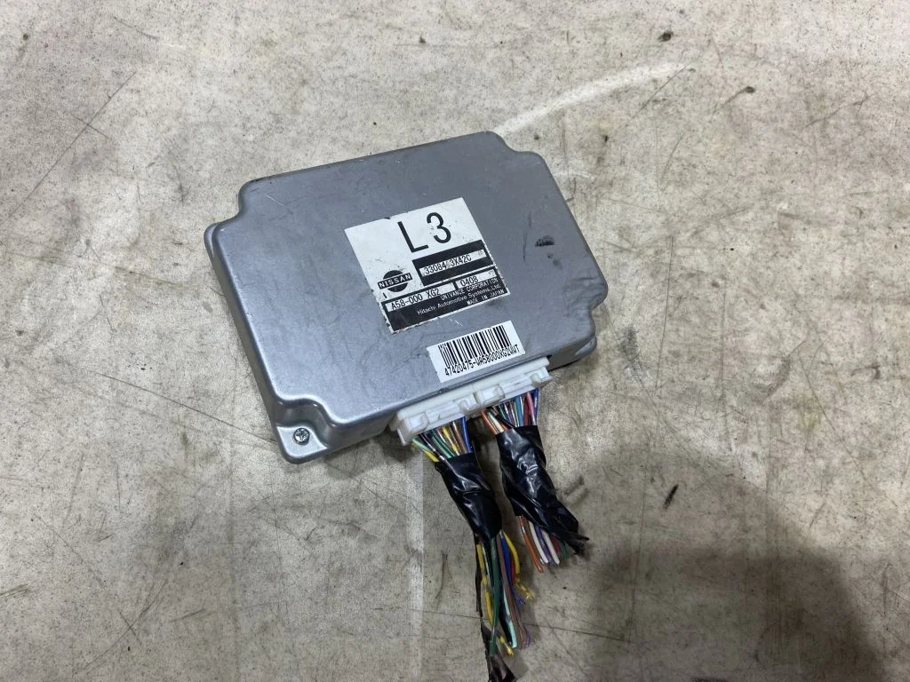 Блок управления раздаткой Nissan Navara D40