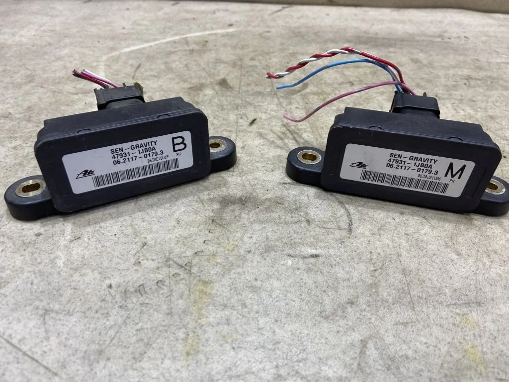 Датчик ускорения Nissan Navara D40