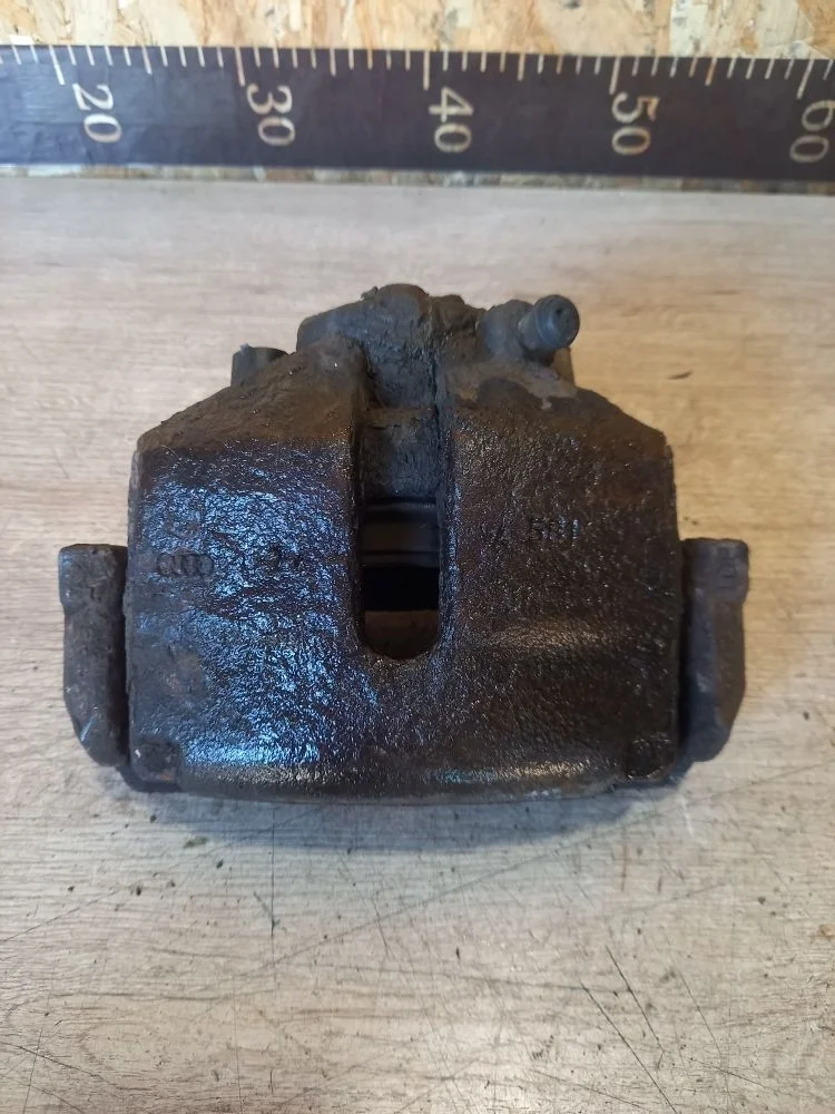 Суппорт тормозной передний левый Skoda Octavia II рестайлинг (2008—2013) 2011