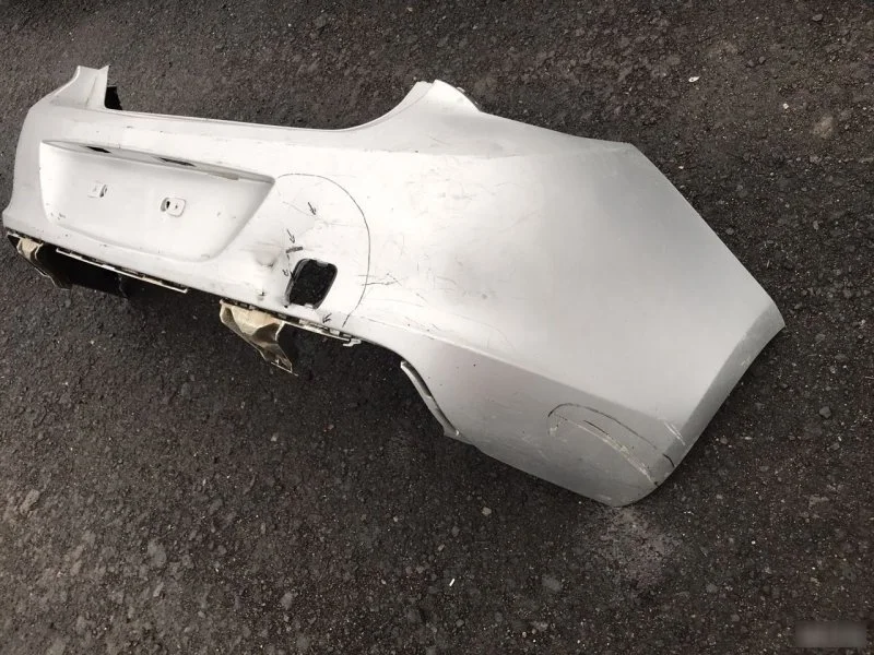 Бампер Opel Astra 2014 седан 20877796 J, задний