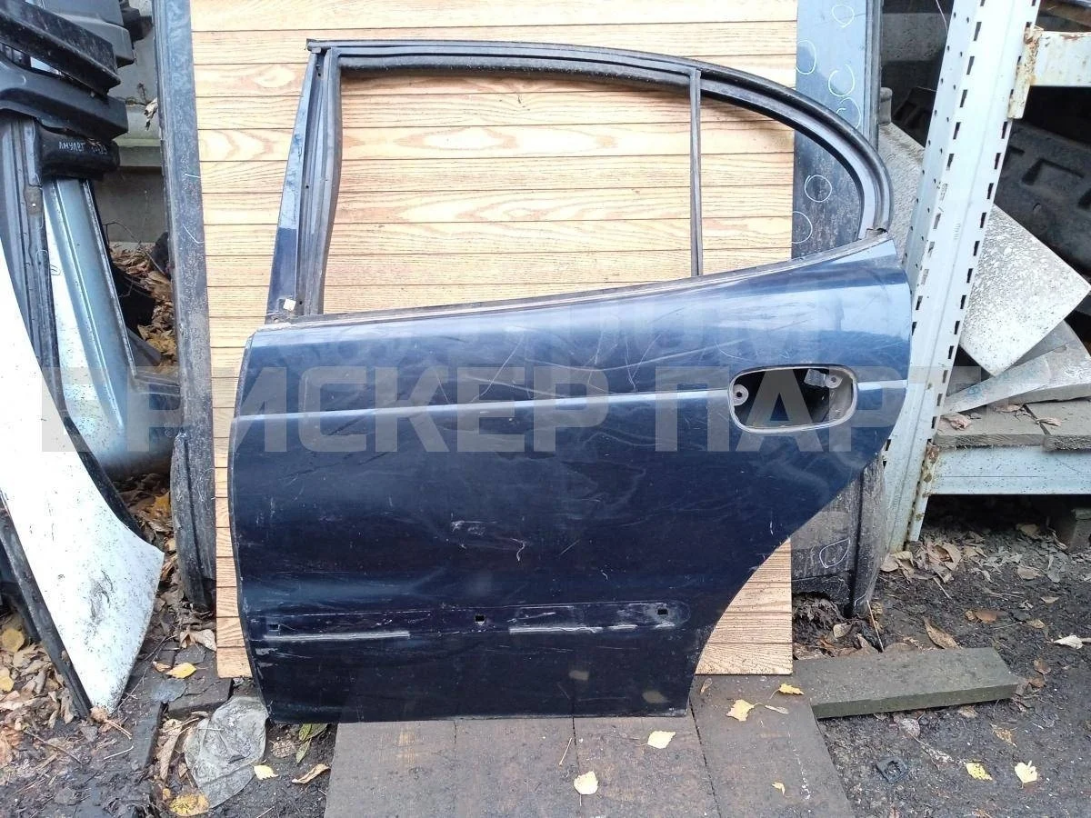 Дверь задняя левая Дэу Леганза 1  V100