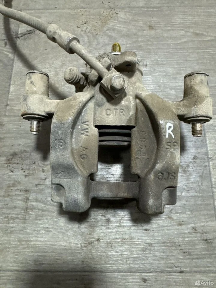 Суппорт тормозной задний правый vag