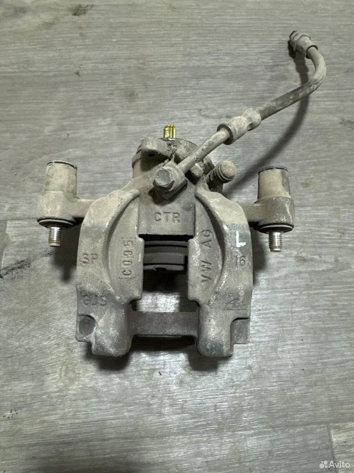 Суппорт тормозной задний левый vag